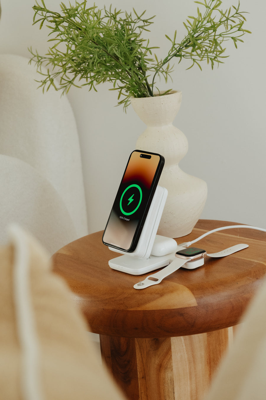 Phone, earbuds and a third device all charging from the PowerDock 2
