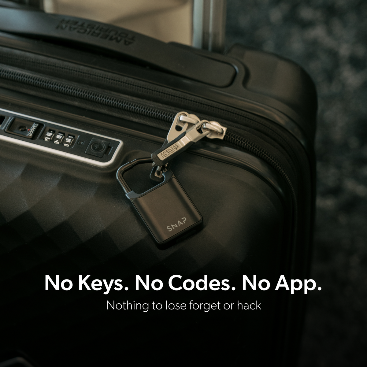 Black Trvlr Lock securing suitcase zipper pulls, with no keys, codes or app required.