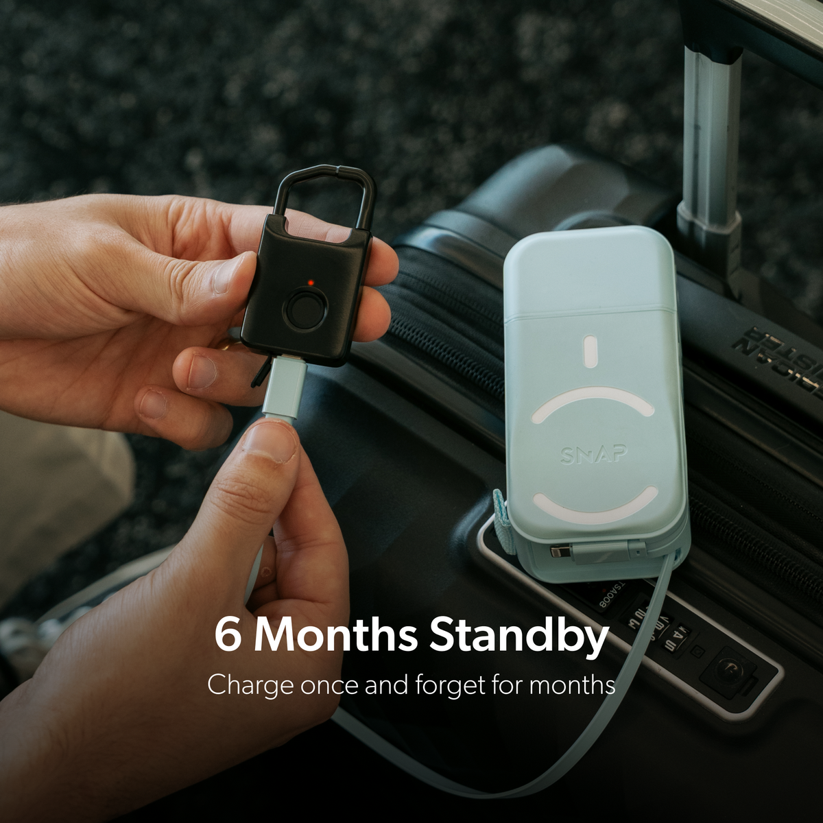 Trvlr Lock connected to a portable power bank by a USB-C cable, with a six-month standby caption.