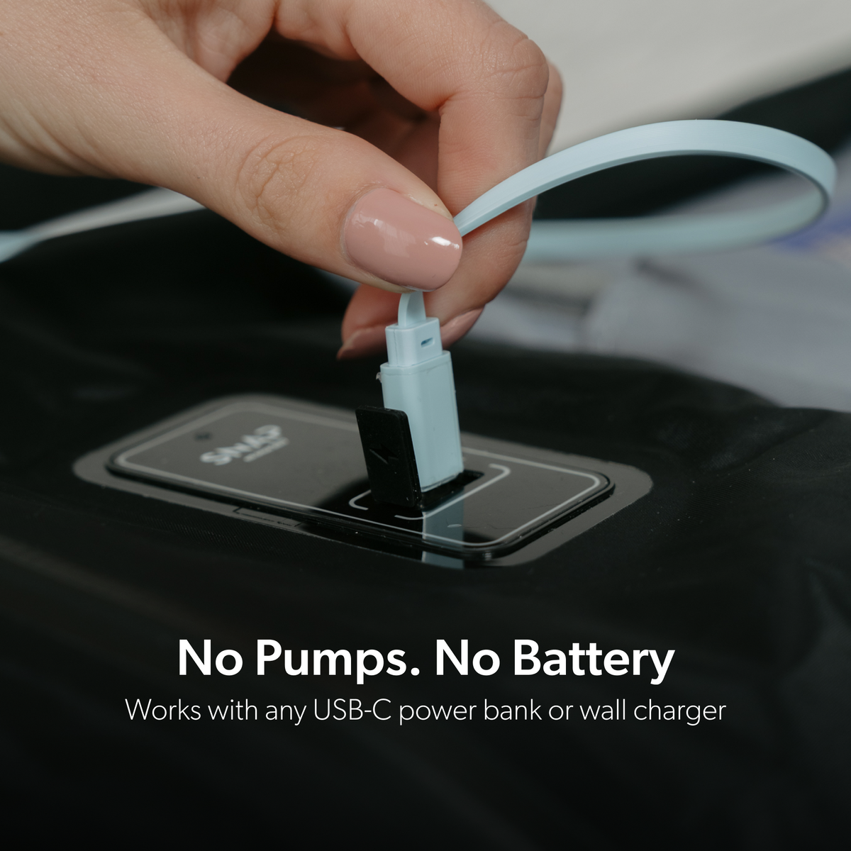 USB-C cable connecting to the TRVLR Vacuum Bag built-in pump