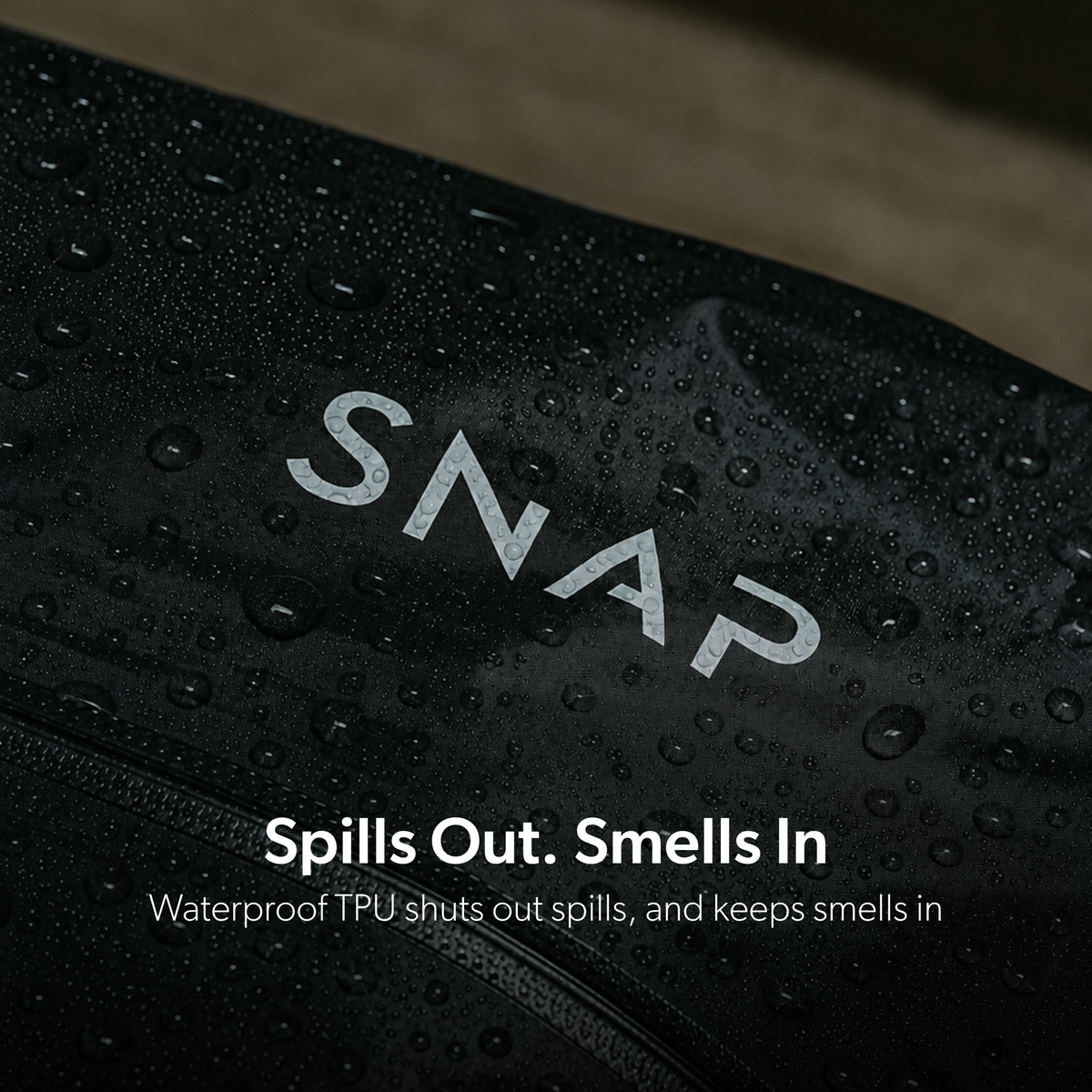 Water droplets on the black TRVLR Vacuum Bag shell