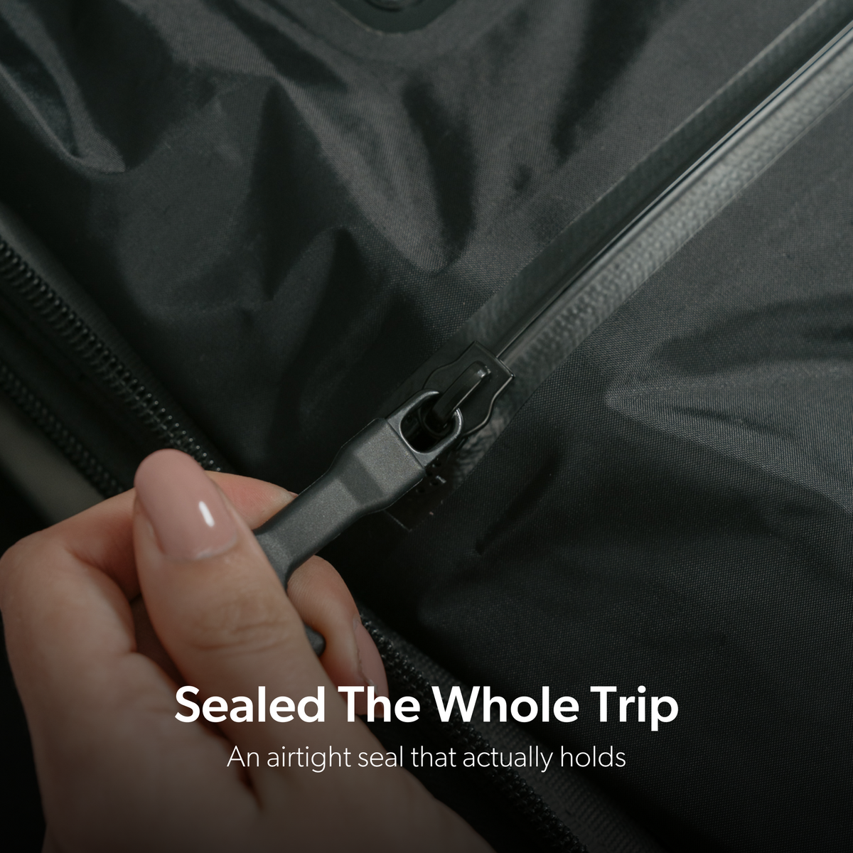 Closing the airtight zipper on the TRVLR Vacuum Bag